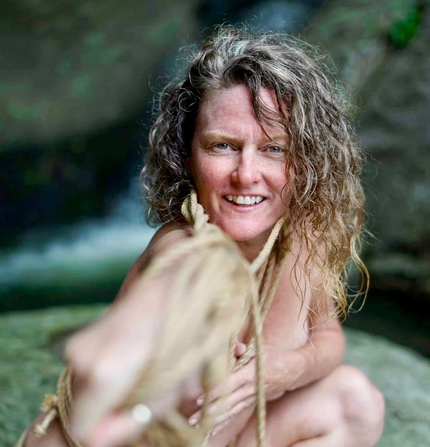 Heather smiling outdoors with rope